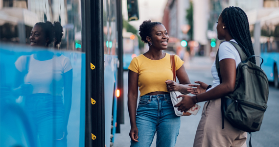 passengers happily boarding a bus
